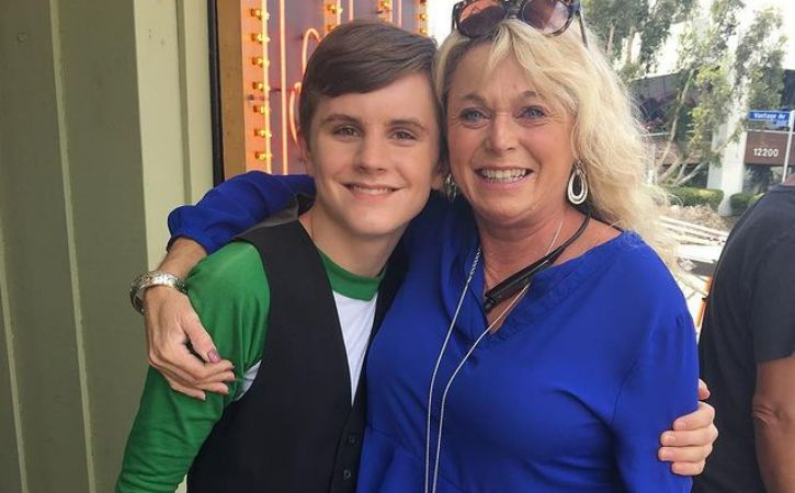 Wil Deusner in a side hug with his Manager
